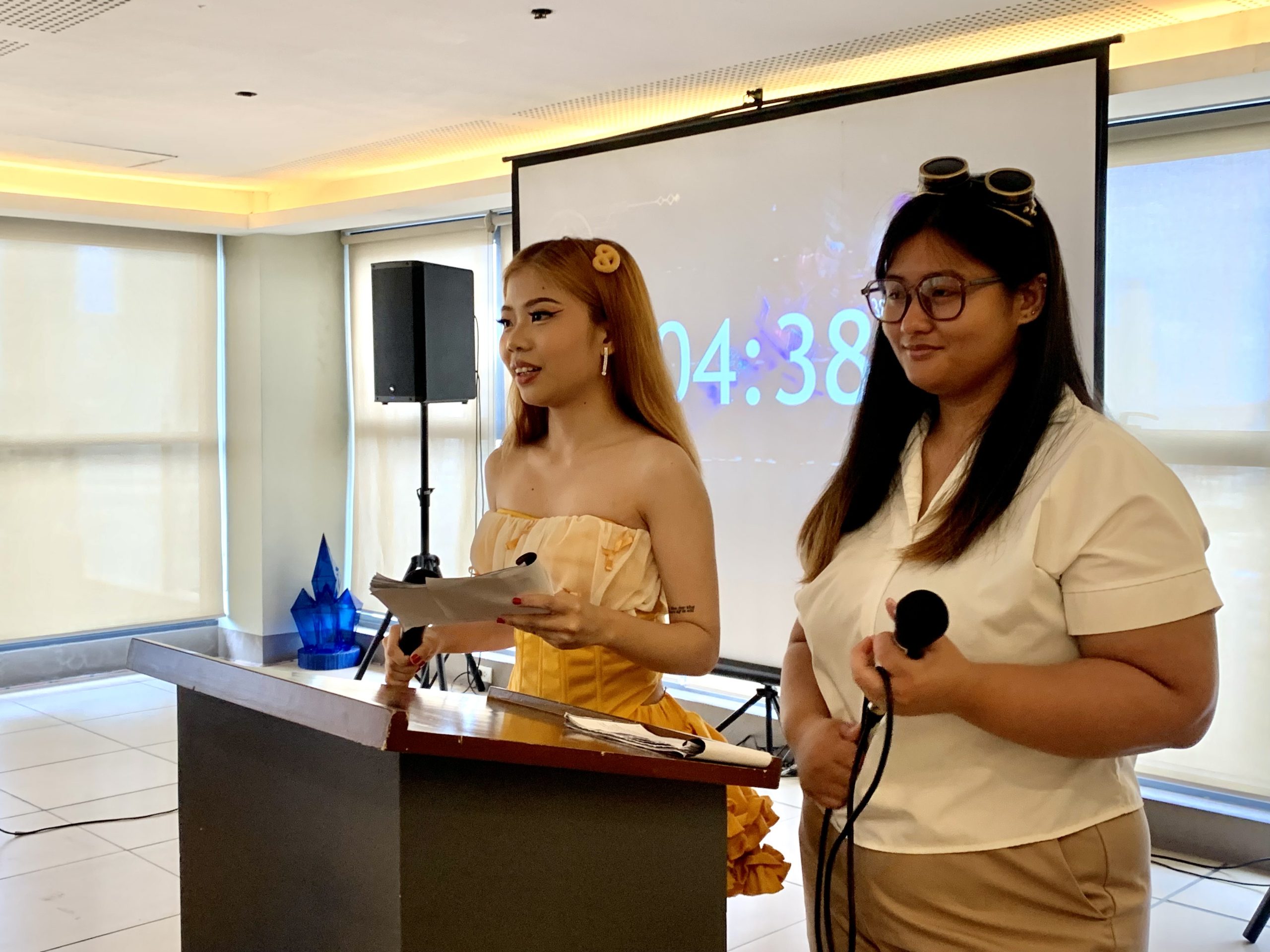 Pauline Mapoy (left) and Nicole Gou (right) emcee FEU Tech’s Multimedia Arts Seminar’s CoeXist: In Pursuit of Progress.